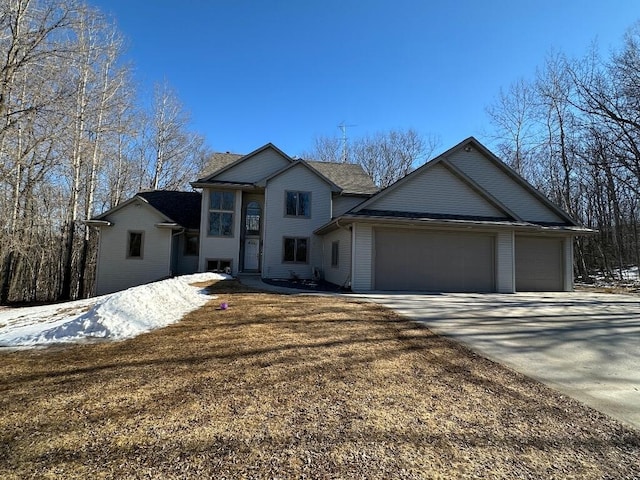 view of front of house with a garage and driveway