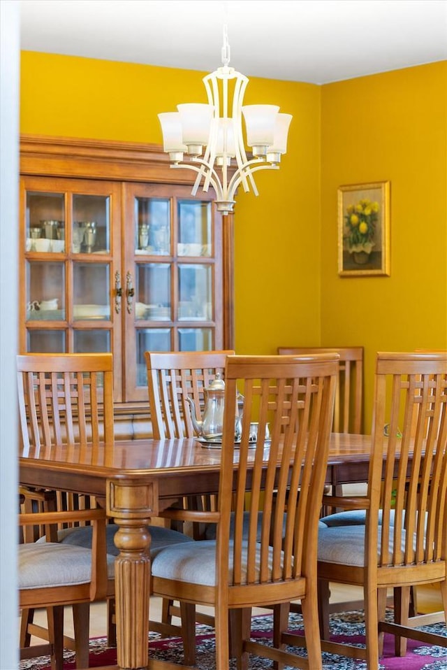 dining area featuring a chandelier