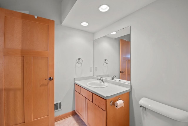 bathroom featuring toilet, recessed lighting, visible vents, baseboards, and vanity