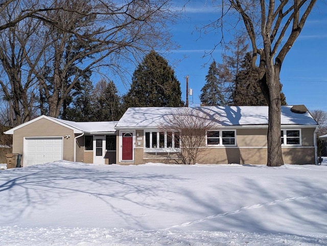 ranch-style house featuring a garage