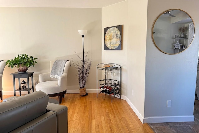 sitting room featuring light wood-style flooring and baseboards