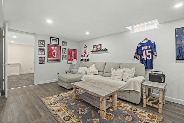 living room with baseboards, wood finished floors, and recessed lighting