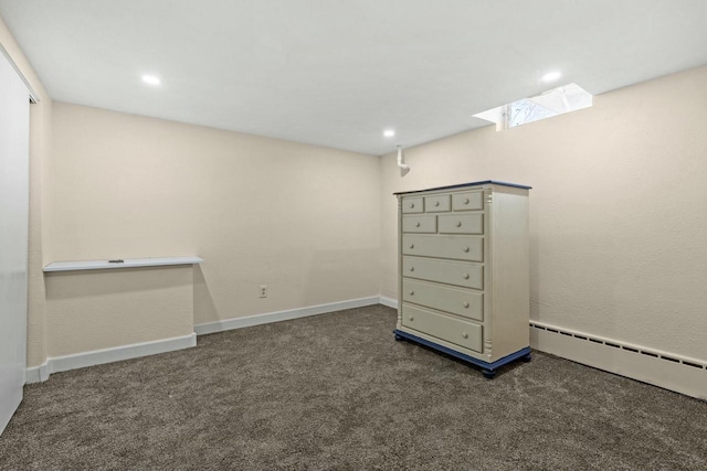 unfurnished room with carpet floors, baseboards, baseboard heating, and recessed lighting