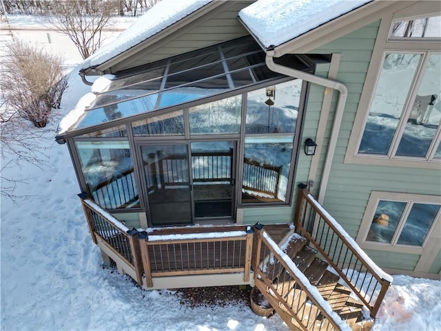 view of snow covered property entrance