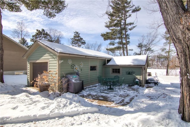 exterior space with a garage and a patio