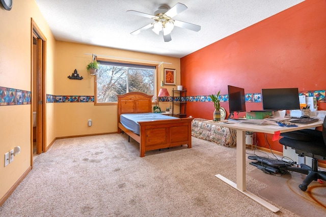 carpeted bedroom featuring a textured ceiling and baseboards