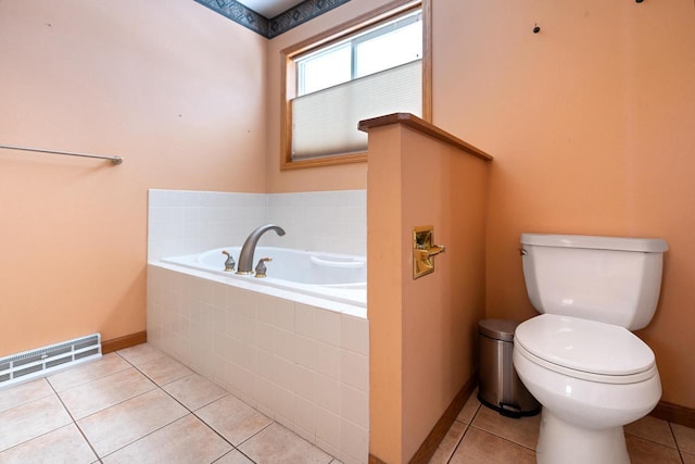 full bath featuring baseboards, visible vents, toilet, tile patterned flooring, and a bath