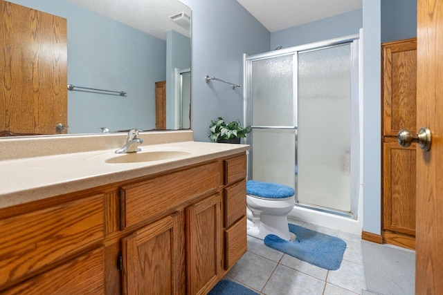 full bath featuring toilet, a stall shower, tile patterned flooring, and visible vents