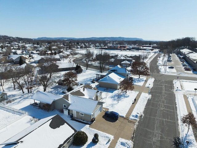 snowy aerial view featuring a residential view