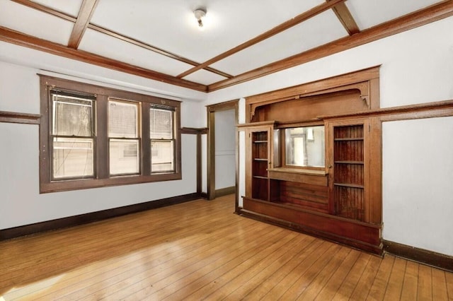 unfurnished living room with light wood-style flooring and baseboards