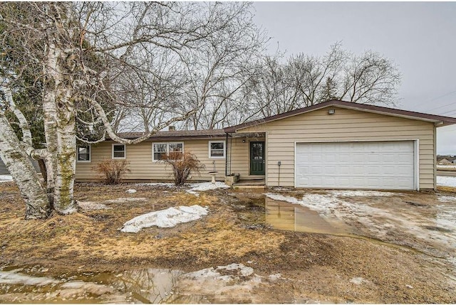 ranch-style house featuring a garage