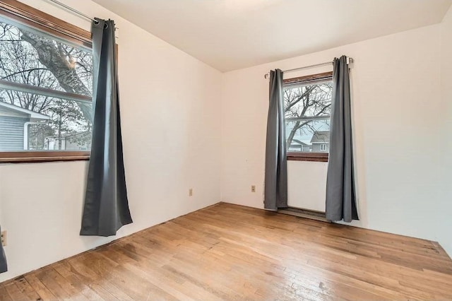 unfurnished room featuring light wood-style flooring