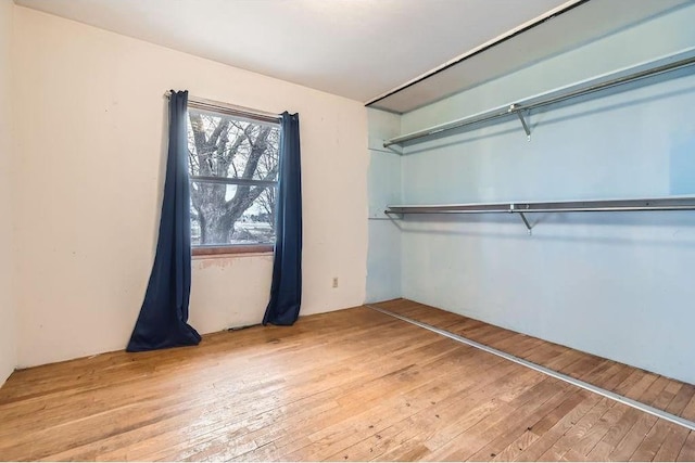 unfurnished bedroom featuring light wood-type flooring