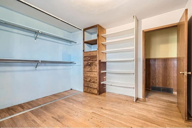 walk in closet featuring visible vents and light wood-style flooring