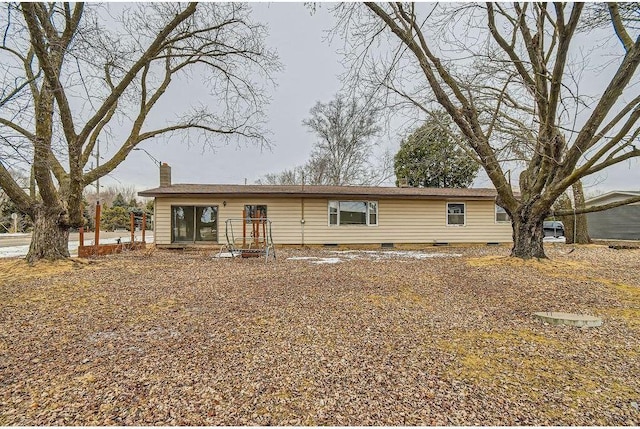 ranch-style home with crawl space and a chimney