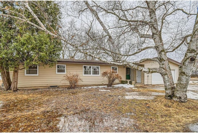 ranch-style home featuring an attached garage