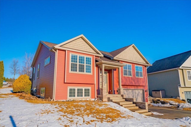 bi-level home featuring a garage