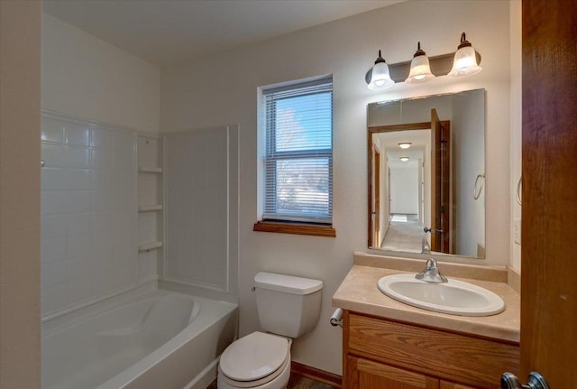 bathroom with  shower combination, vanity, and toilet