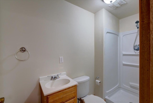 full bathroom with toilet, a stall shower, visible vents, and vanity