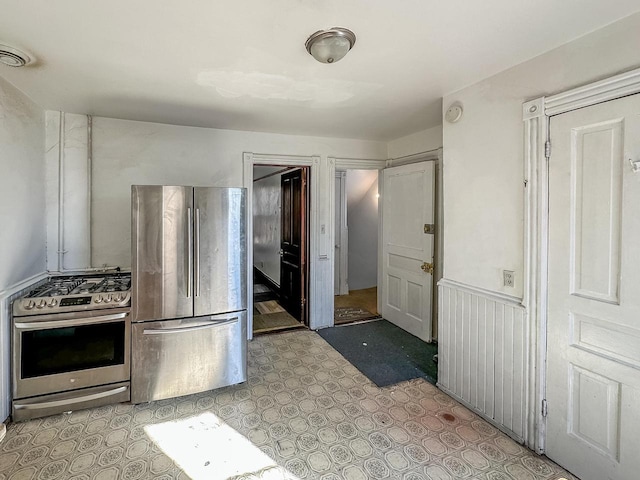 kitchen with stainless steel appliances and wainscoting