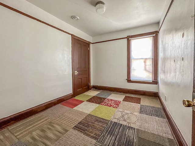 unfurnished bedroom with visible vents and baseboards