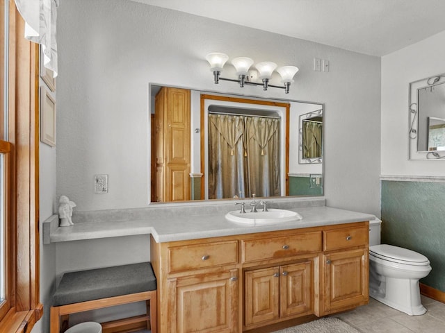 full bath with toilet, tile patterned floors, a shower with shower curtain, and vanity