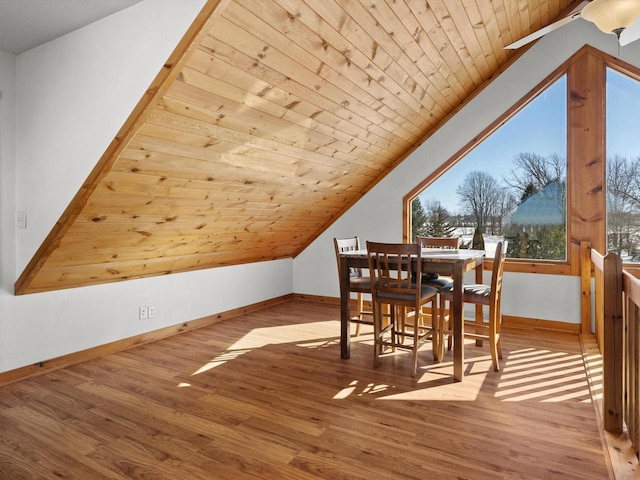 bonus room with wooden ceiling, light wood-style flooring, baseboards, and vaulted ceiling