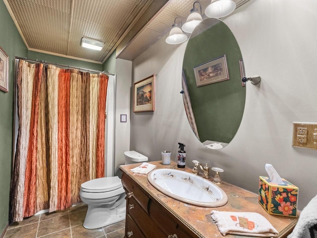 bathroom with ornamental molding, vanity, toilet, and tile patterned floors