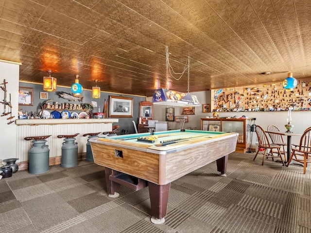 recreation room featuring an ornate ceiling, dark colored carpet, billiards, and a dry bar