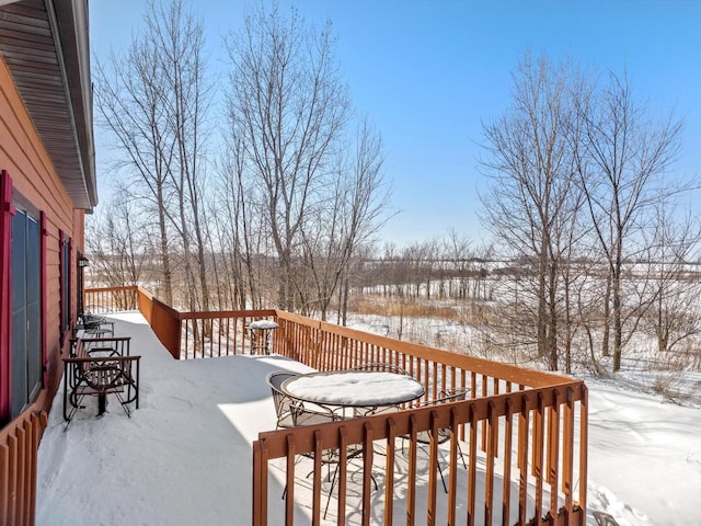 view of snow covered deck