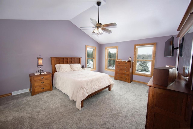 bedroom featuring visible vents, baseboards, light colored carpet, ceiling fan, and vaulted ceiling