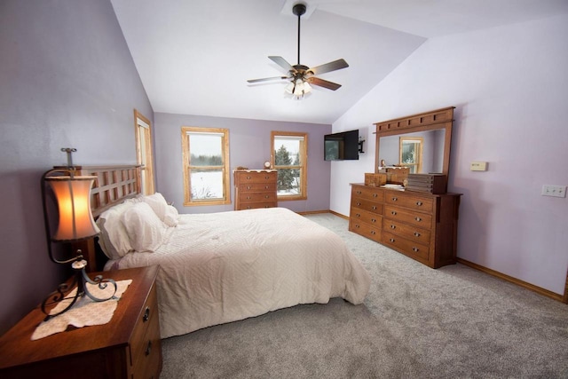 bedroom with light carpet, baseboards, vaulted ceiling, and a ceiling fan