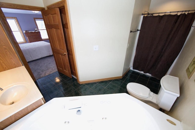 full bath featuring connected bathroom, toilet, a shower with curtain, tile patterned flooring, and vanity