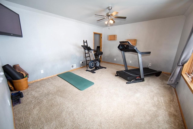 workout area with carpet floors, baseboards, visible vents, and a ceiling fan