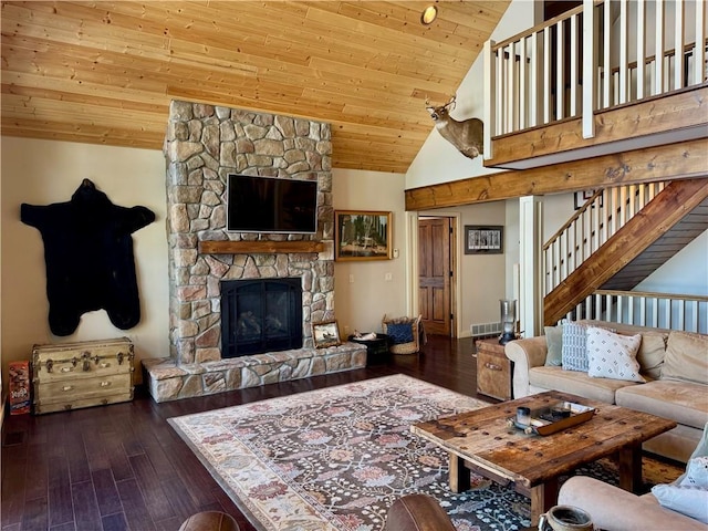 23310 Clam Lake Rd, Clam Lake, WI 54517 - living room with dark wood-style floors, wood ceiling, a stone fireplace, high vaulted ceiling, and stairs