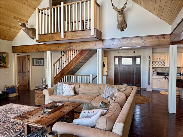23310 Clam Lake Rd, Clam Lake, WI 54517 - living room featuring dark wood-type flooring, wooden ceiling, high vaulted ceiling, and stairway