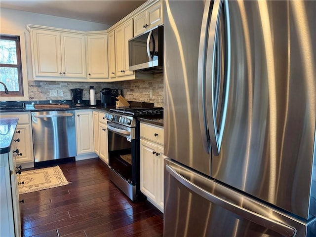 23310 Clam Lake Rd, Clam Lake, WI 54517 - kitchen with a sink, stainless steel appliances, backsplash, and dark wood finished floors