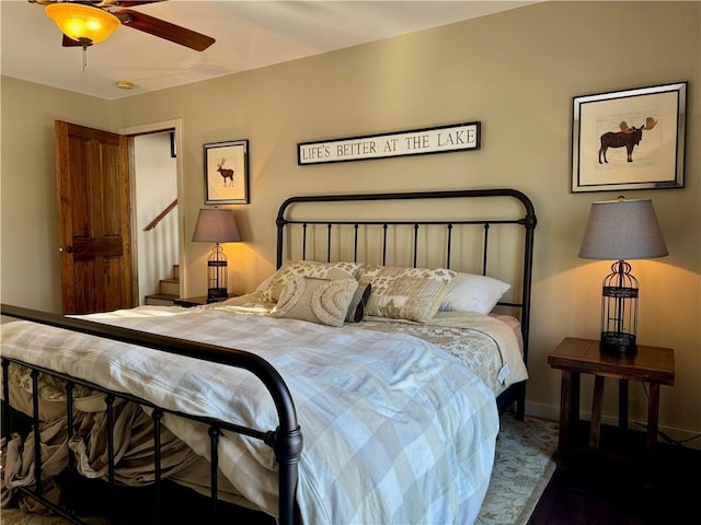 23310 Clam Lake Rd, Clam Lake, WI 54517 - bedroom with baseboards and a ceiling fan