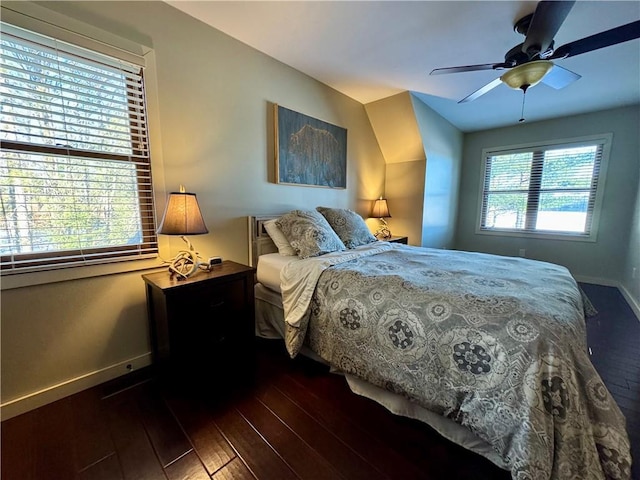 23310 Clam Lake Rd, Clam Lake, WI 54517 - bedroom with ceiling fan, baseboards, and dark wood-type flooring