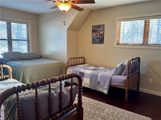 23310 Clam Lake Rd, Clam Lake, WI 54517 - bedroom with dark wood finished floors, baseboards, and ceiling fan