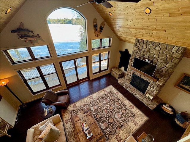 23310 Clam Lake Rd, Clam Lake, WI 54517 - living room with dark wood-style floors, ceiling fan, a stone fireplace, high vaulted ceiling, and wooden ceiling