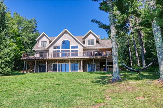 23310 Clam Lake Rd, Clam Lake, WI 54517 - back of property featuring stone siding, a lawn, and a wooden deck