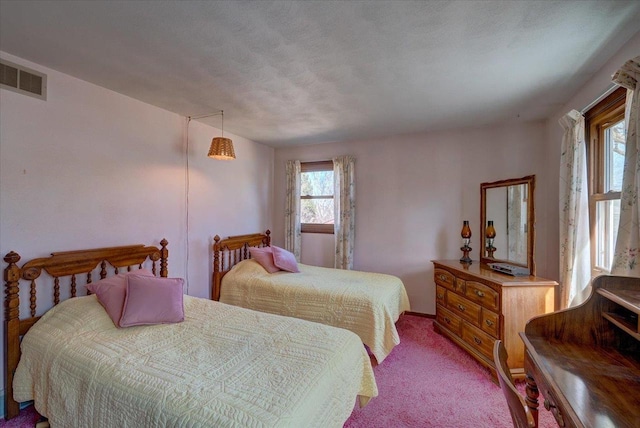 carpeted bedroom with visible vents