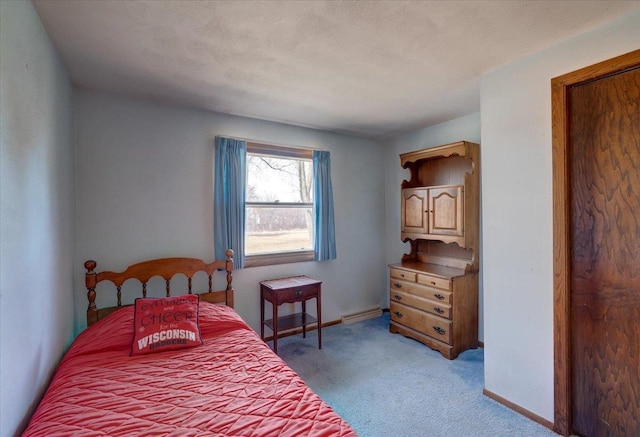 bedroom featuring visible vents, light colored carpet, and baseboards