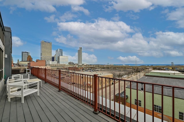 wooden deck with a city view