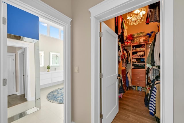 interior space featuring a notable chandelier and wood finished floors