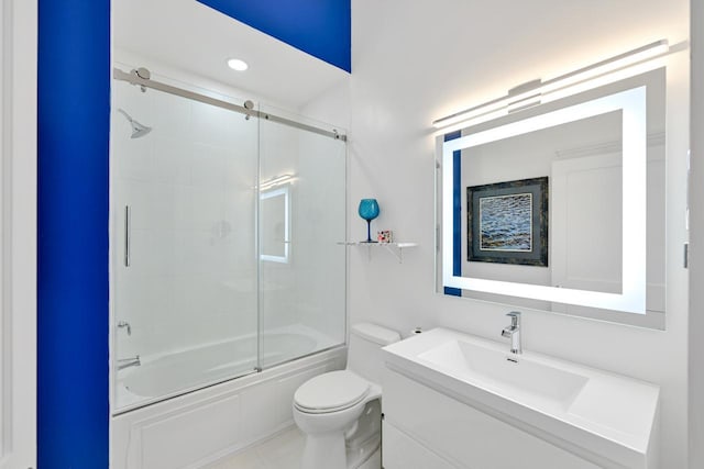 full bathroom with recessed lighting, shower / bath combination with glass door, vanity, and toilet