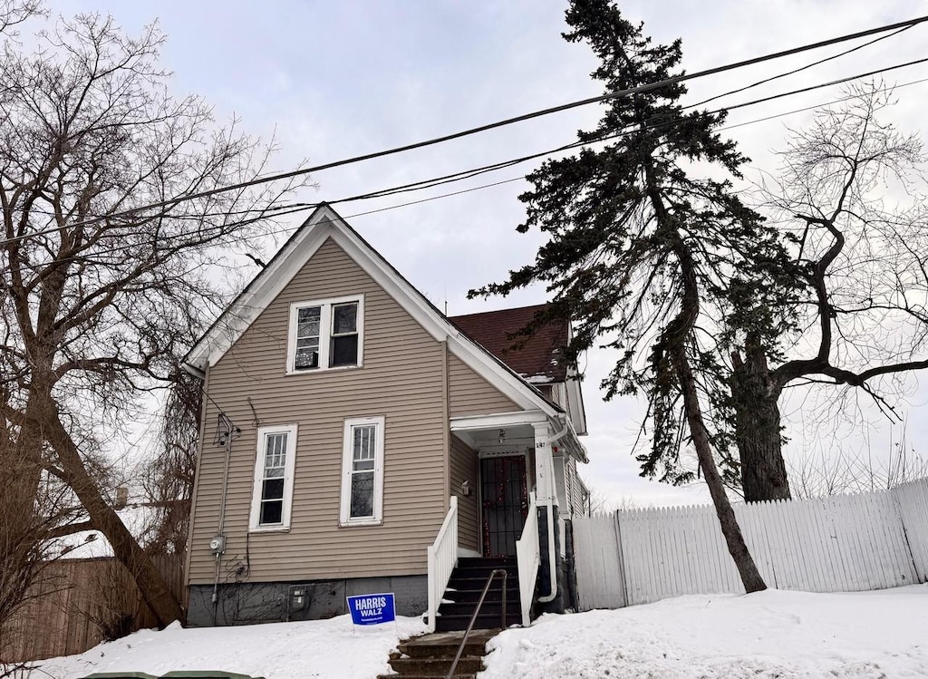 view of front of home with fence