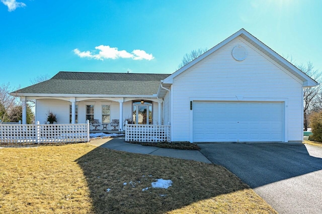 single story home featuring a porch, a shingled roof, a garage, driveway, and a front lawn