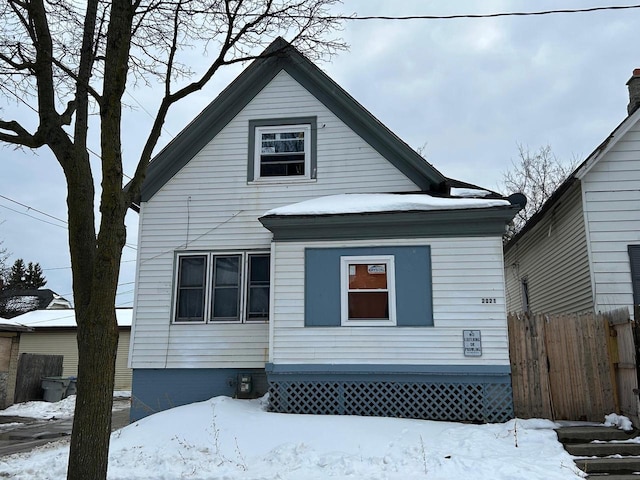 view of front of home featuring fence